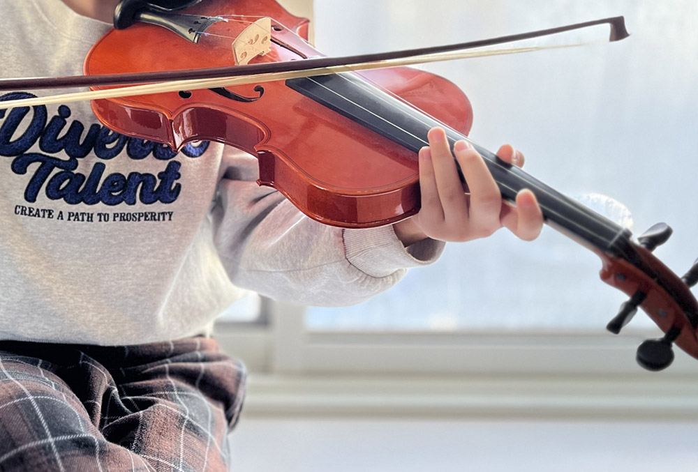 boy playing violin