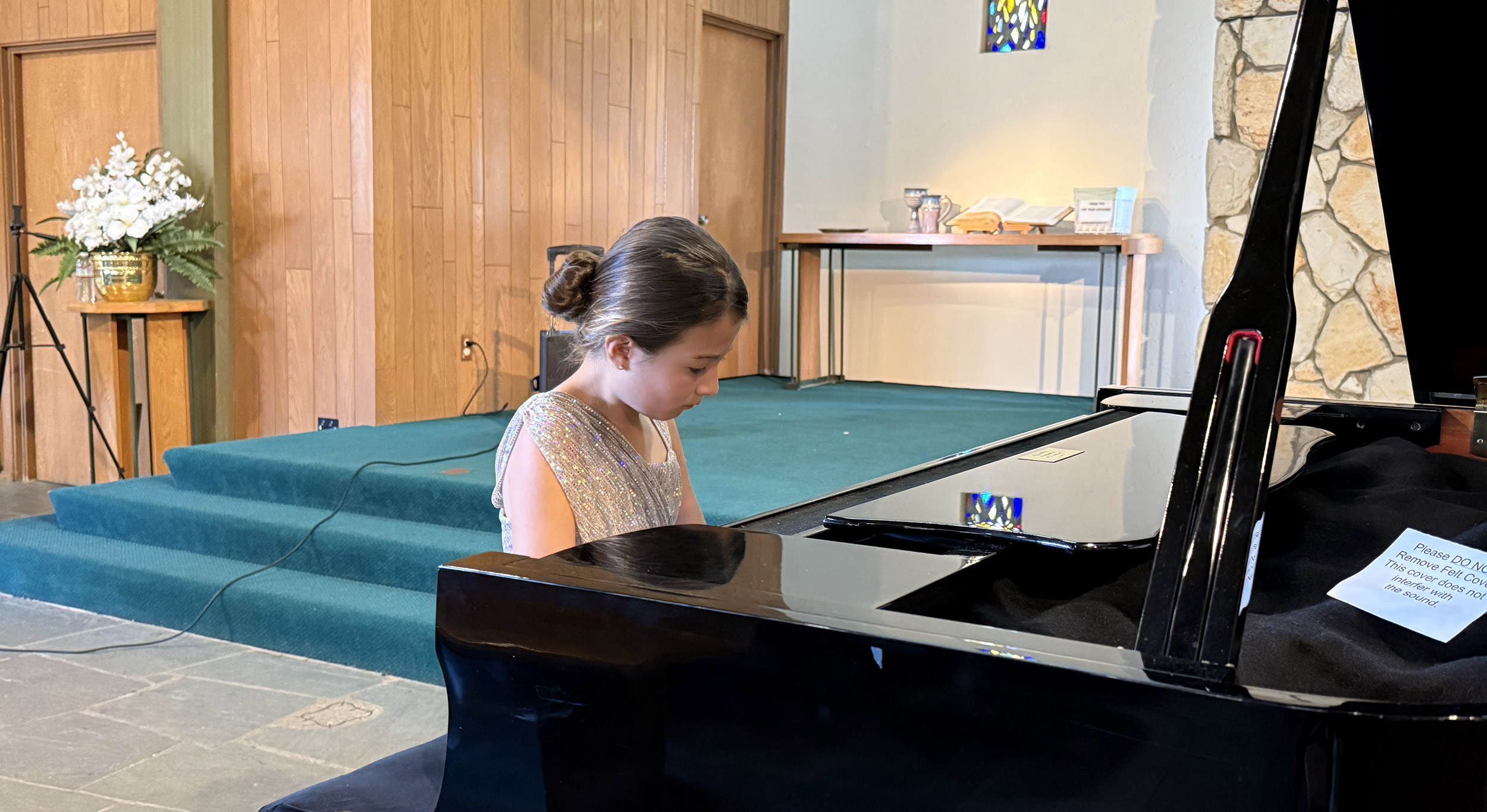 girl playing piano